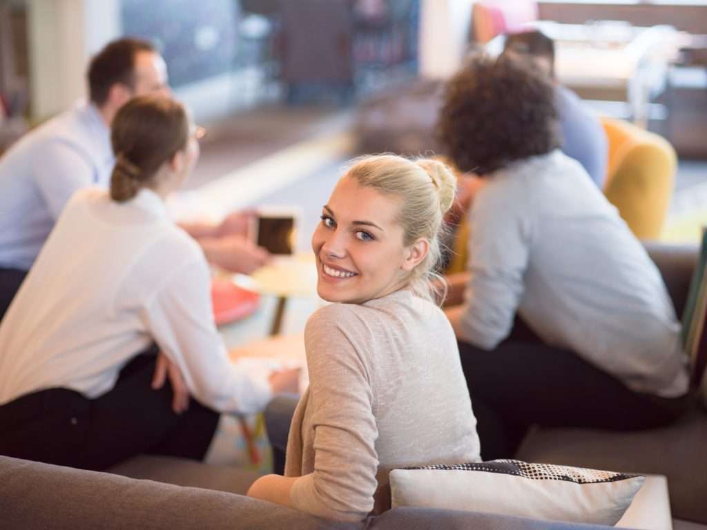 Group of a young business people discussing business plan at modern startup office building