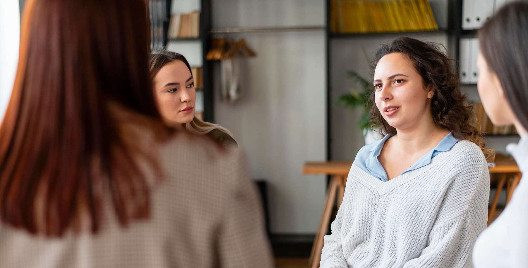 Women attending a group therapy session.